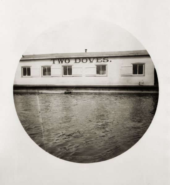 View of a houseboat named "Two Doves" on the Ohio River.