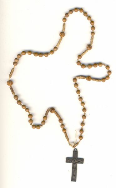 A rosary made of wooden (probably) beads and a dark, metal cross.