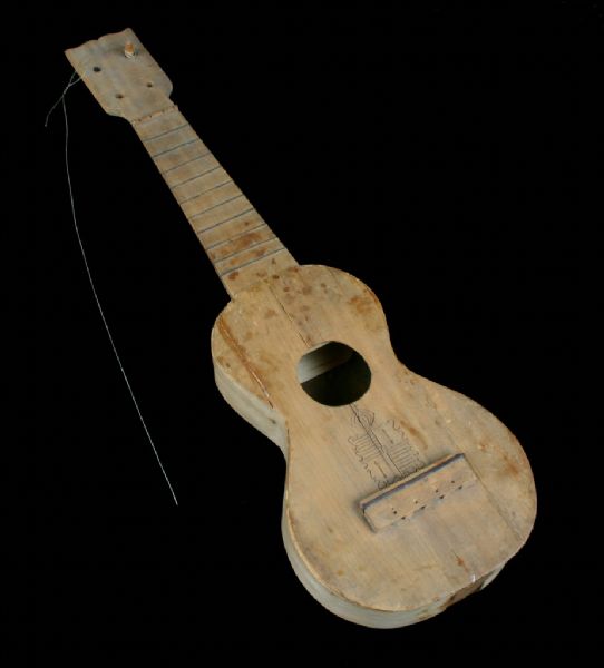 A ukulele made of koa wood and a Bull Durham cigar box.