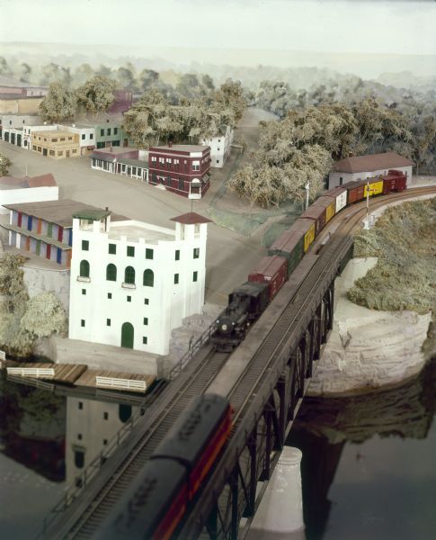A Wisconsin Dells minirama miniature model showing a short train with a Prairie-type locomotive on the bridge over the Wisconsin River.