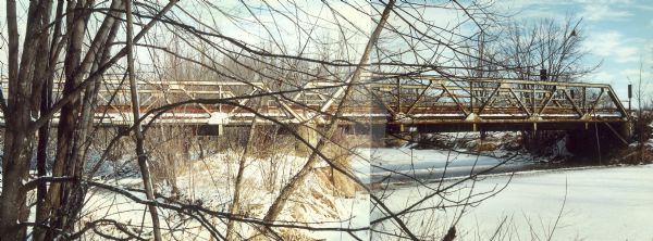Panoramic view of the bridge over the frozen Eau Claire River.