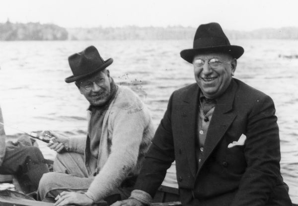 Governor Philip La Follette (Wisconsin) and Governor Henry Horner (Illinois) enjoy a laugh in the boat during a fishing trip.