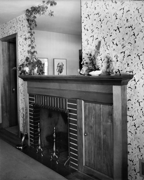 Fireplace with a large mirror above the mantel, in the Byron and Mary Burch house, 205 South Owen Drive.
