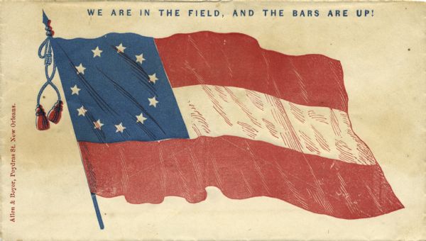 The first national flag of the Confederacy (Stars and Bars) and the slogan: "We are in the field, and the bars are up!" Red and blue ink on cream envelope, the illustration covers entire front.