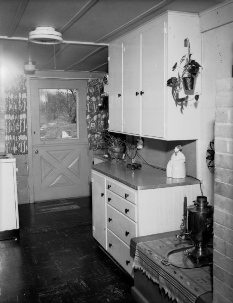 Interior view of the house of Professor Ruth B. Glassow at 1635 Norman Way showing a door and a countertop. The house had been a barn on the estate of John R. Commons, a world-renowned University of Wisconsin economist.