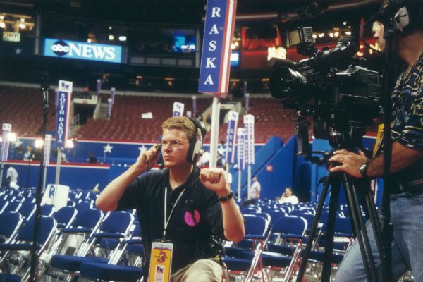 A member of the CNN (Cable News Network) broadcast team testing equipment on the floor of the Republican Convention in Philadelphia.