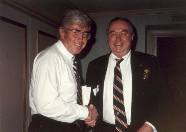 Subscribers to the newsletter issued by journalists Rowland Evans and Robert Novak, the Evans-Novak Political Report, were able to attend regular forums at which prominent political leaders spoke off the record.  Here, Congressman Jack Kemp shakes hands with Robert Selle at one of these forums.