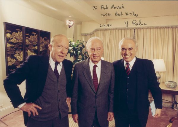 Journalists Rowland Evans (left) and Robert Novak (right), with Israeli premier Yitzhak Rabin.