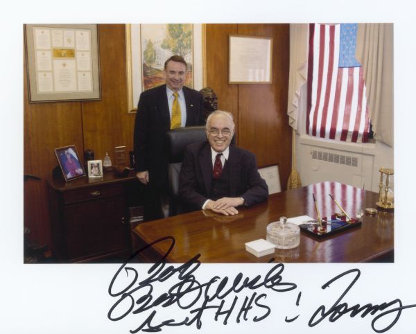 Tommy G. Thompson, former governor of Wisconsin, standing in his office as Secretary of the Department of Health and Human Services with journalist Robert Novak. Thompson served from 2001 to 2005.