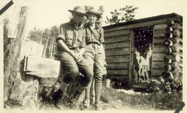 Sigurd F. Olson (April 4, 1899 - January 13, 1982) was an American author, environmentalist, and advocate for the protection of wilderness. He is seated outdoors on a fence next to his wife, Elizabeth, on their honeymoon.