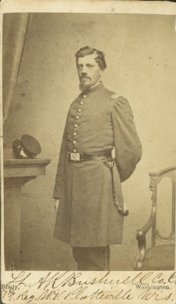 Standing three-quarter length portrait of A.R. Bushnell, Company C of the 7th Wisconsin Volunteers.