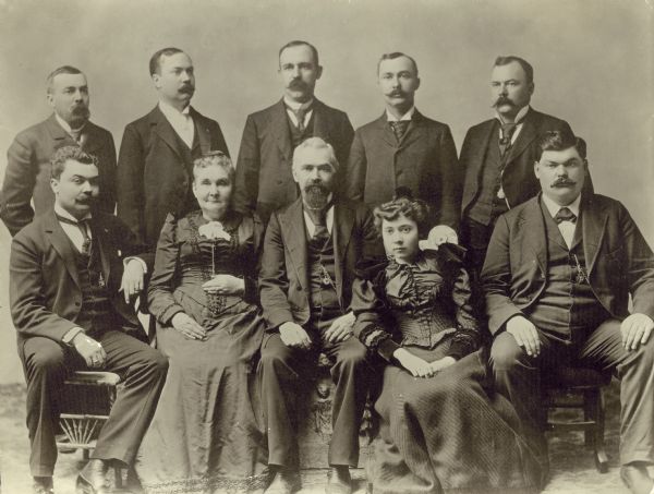Studio group portrait of the Ringling family, including Al Ringling.  The brothers in the photo are: John (sitting left ), Al, Alfred "Alf T.," August "Gus," Carl “Charles," Otto, and Henry (sitting right). The daughter's name is Ida.