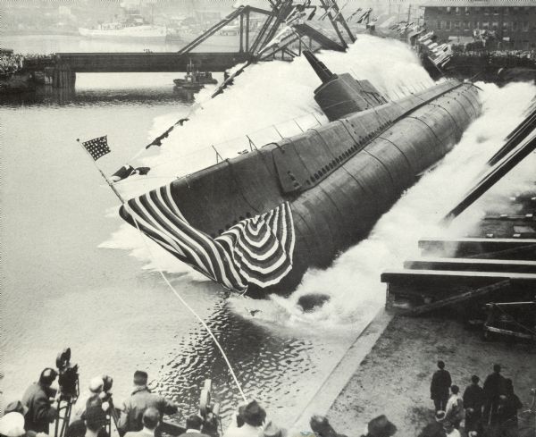 USS "Peto" (SS-265), a Gato-class submarine, was a ship of the United States Navy named for the peto, a sharp-nosed tropical fish of the mackerel family. "Peto" (SS-265) was laid down 18 June 1941 by the Manitowoc Shipbuilding Company, Manitowoc, Wisc.; launched 30 April 1942; sponsored by Mrs. E.A. Lofquist; and commissioned 21 November 1942, Lt. Comdr. William T. Nelson in command. Late in December 1942 "Peto" decommissioned, was loaded on a barge, and departed Manitowoc for New Orleans, the first submarine to traverse the mid-western waterways to reach New Orleans and the sea from the building yards. The ship recommissioned, completed fitting out and shakedown, sailed for the Panama Canal and arrived Brisbane, Australia 14 March 1943.