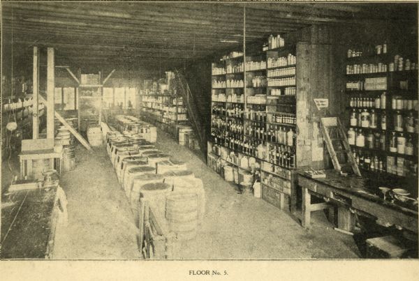 Interior of (Floor No. 5) The F. Dohmen Company Wholesale Druggists. A salesman's catalog with removable screwed bindings and pages of note paper bound between catalog pages. (One of 13 halftones of the company's exterior and interior images included in catalog.)