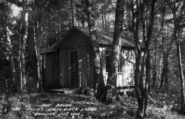 Exterior view of the Raven, a humble cottage in the woods at Wilsie's White Birch Lodge.