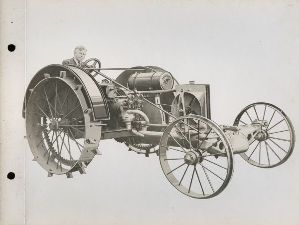Front three-quarter view of right side of a La Crosse Tractor operated by a man in a suit.