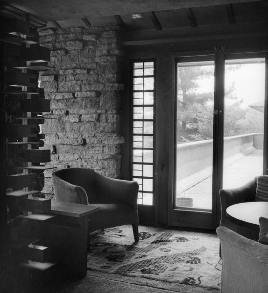 Corner of the living room at Taliesin, the summer home of Frank Lloyd Wright, showing the door out to the Bird Walk. Taliesin is located in the vicinity of Spring Green, Wisconsin.
