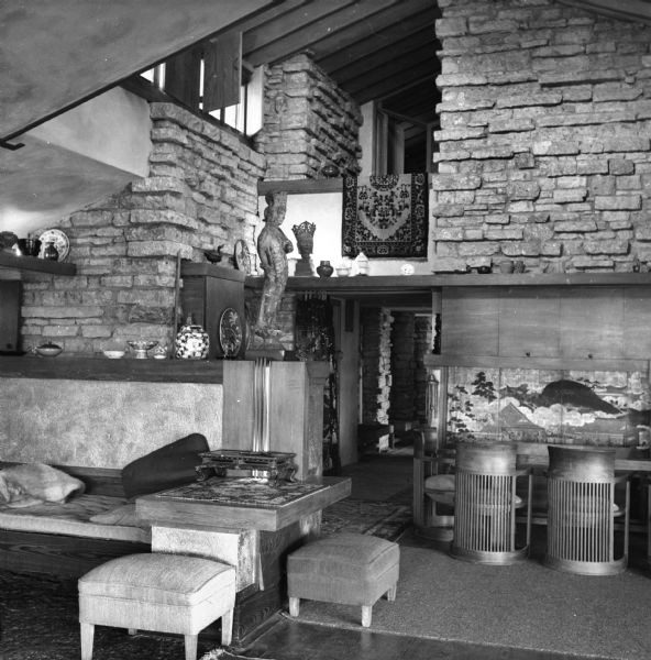 The living room at Taliesin, the Wisconsin home of Frank Lloyd Wright, looking towards the dining room and entrance hallway. Taliesin is located in the vicinity of Spring Green, Wisconsin.