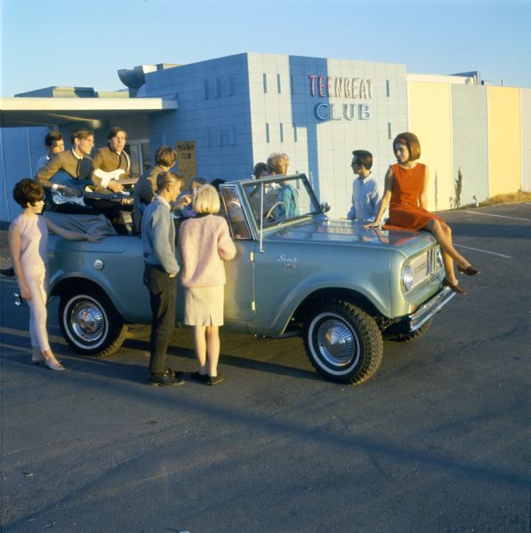 Color advertising photograph of teenagers and members of a rock and roll band gathered in and around an International Scout pickup at the Teenbeat Club owned by Steve Miller and Keith Austin. Known for the Teenbeat Club Television Program sponsored by Pepsi Cola, The club was the centerpiece of the highly rated Teenbeat Club television program which aired in prime time, 5-6 PM, each Saturday from 1962 through 1966 on KLAS TV in Las Vegas.