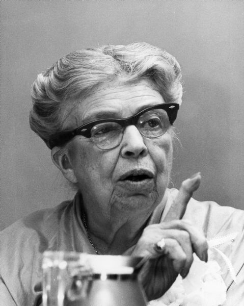 This photograph won the top award for 1959 Wisconsin Press Photographer's Association Pictures Competition, Personality category. Eleanor Roosevelt was photographed at a press conference held just before she delivered her formal lecture at the Wisconsin Union Theater. Her speech made a plea for greater concern by individual citizens to help the United State assume the leadersip role in the free world to fight communism.