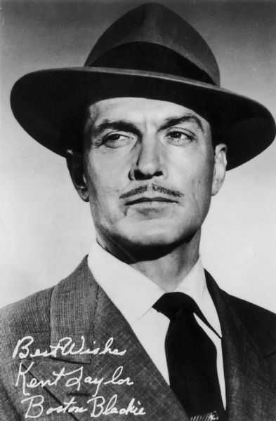 Kent Taylor depicted as Boston Blackie from the television series of the same name. This photograph includes a signature.