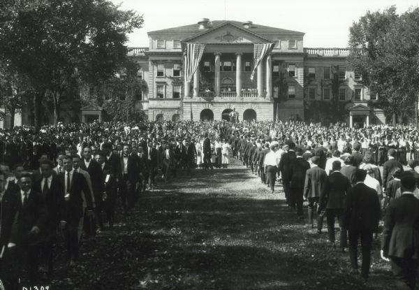 A large crowd gathers for a freshman welcome on Bascom Hill, located on the University of Wisconsin-Madison campus.