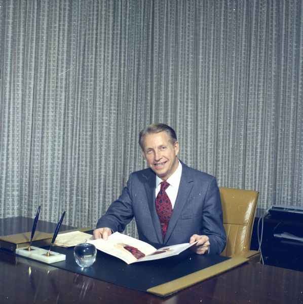 Portrait of J.M. Smucker Company executive Paul Smucker sitting at his desk.