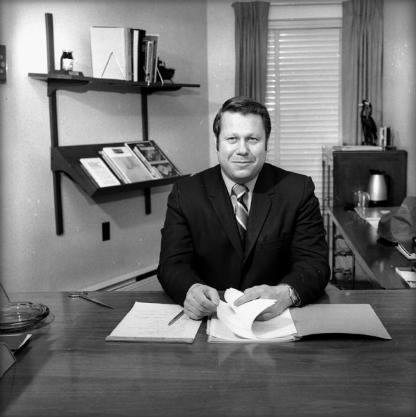 Portrait of J.M. Smucker Company executive Robert Morrison sitting at a desk in an office.