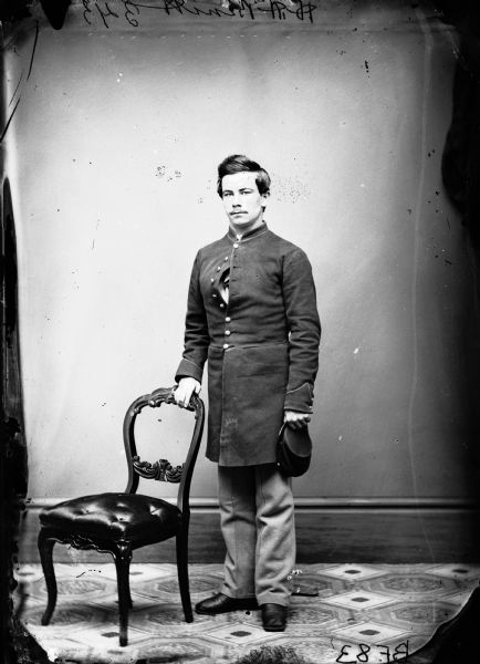 Bennett in uniform, showing his crippled right hand, taken when he was 23-years-old after he was ministered out of the Army.  The hand wound was caused by the accidental discharge of his gun.  This photograph was most likely made by Leroy Gates before H.H. bought his gallery.