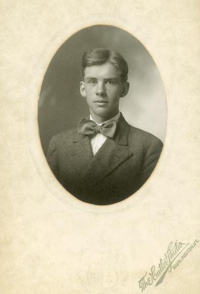 Quarter-length studio portrait of Charles Wheeler wearing a big bow tie.
