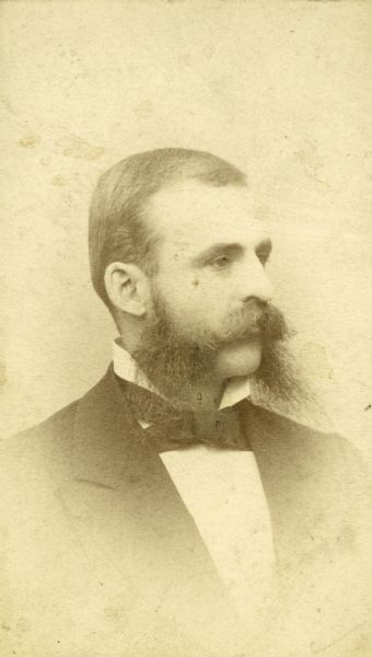 Quarter-length studio portrait of E.P. Wheeler with lengthy sideburns.