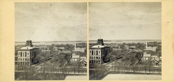 Elevated view up Wisconsin Avenue showing City Hall with the Post Office to the right. Also visible is the Presbyterian Church.