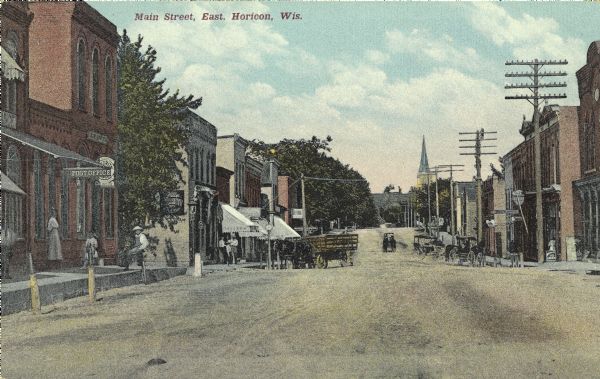 Colorized view down Main Street. Caption reads: "Main Street, East, Horicon, Wis."