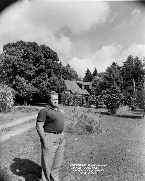 Wisconsin author August Derleth standing in front of his Sauk City home, "the Place of the Hawks."