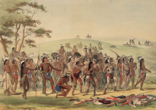 Mandan Indians engaged in archery competition (Plate 24).<p>"The meeting represented here is something like that of an Archery Club in the civilized world, but for a different mode of shooting. Having but little necessity for correct shooting at a long distance, as I have mentioned in an early part of this work, their hunting and warring being chiefly done from the backs of their running horses, their great merit in archery with them consists in the rapidity and force with which they can discharge their arrows from their bows; and the strife in this game (in which I have given striking portraits from the life, of several of the leading young men of the tribe) was to decide who could discharge from his bow the greatest number of arrows before his first one should fall to the ground; each arrow to pass over a certain line sufficiently distant to characterize it as a clean and efficient shot."</p>
