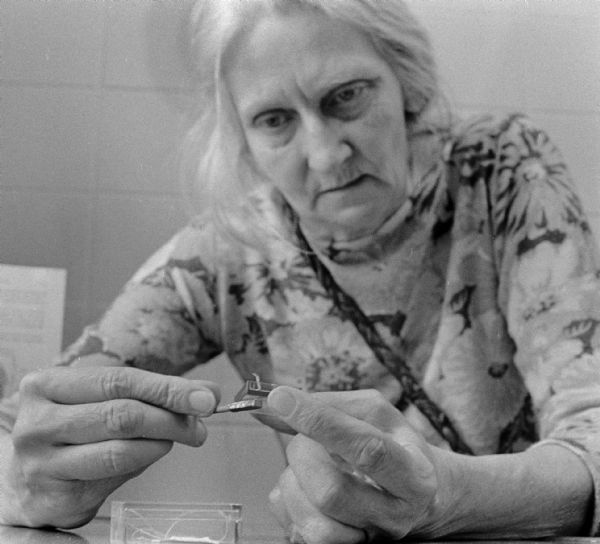 Portrait of Edna Wilmington, demonstrating her work with magnets.