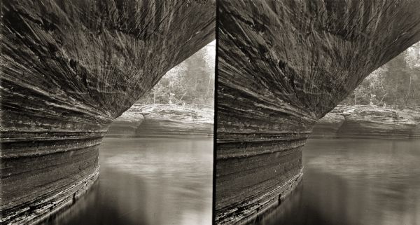 Stereograph of the overhang at the geological formation known as Black Hawk's Leap.