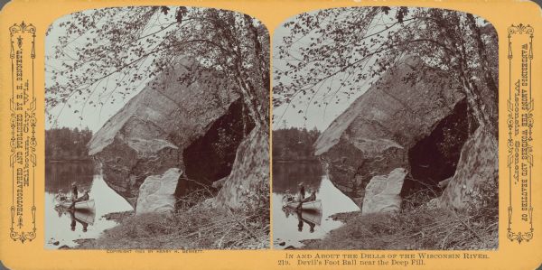 Stereograph from shoreline of three people in a canoe next to the rock formation Devil's Football, near the Deep Fill.