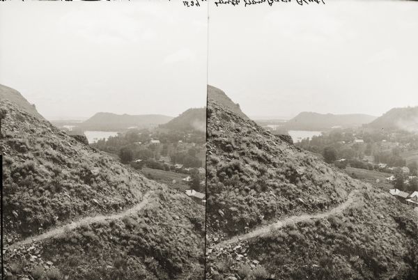 Stereograph of elevated view of Barn Bluff. The Mississippi River is in the far background.