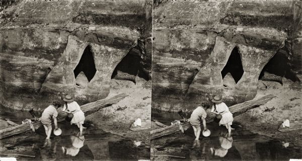 Sterograph of two children wading at the Diamond Grotto.