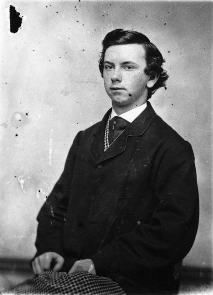 Waist-up studio portrait of George Bennett, brother of H.H. Bennett, as a young man.