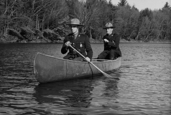 Wisconsin wardens patrolling waters of Wisconsin in a canoe.