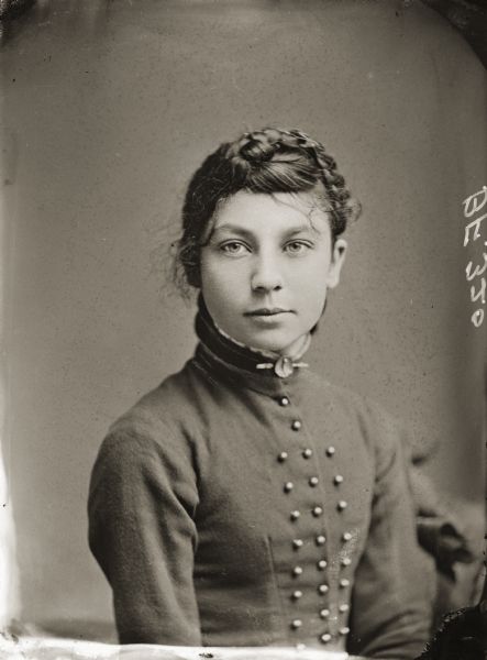 Waist-up studio portrait of Hattie Snider, daughter of H.H. Bennett.