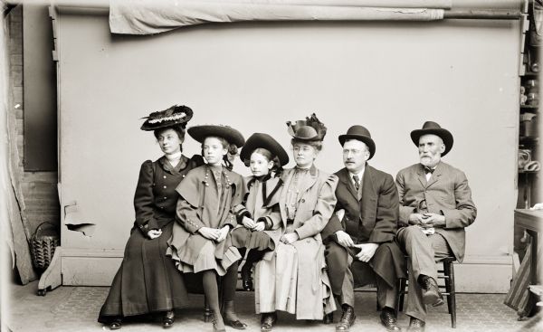 Studio portrait of the family of George Crandall, son-in-law of Henry Hamilton (H.H.) Bennett. This portrait includes Hattie, Bennett's daughter from his first marriage.