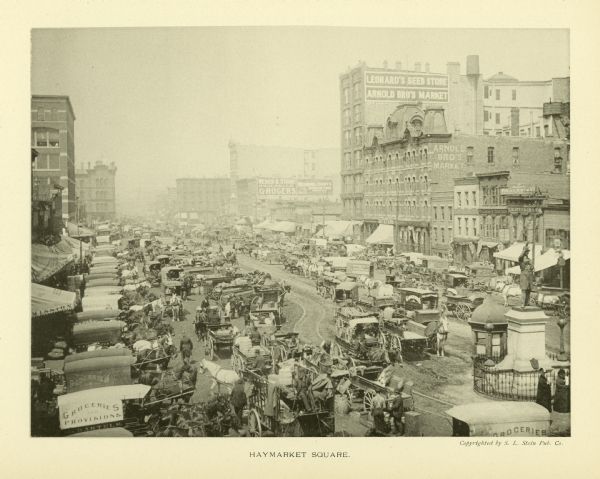 Elevated view of a busy Haymarket Square crowded with horse-drawn wagons.