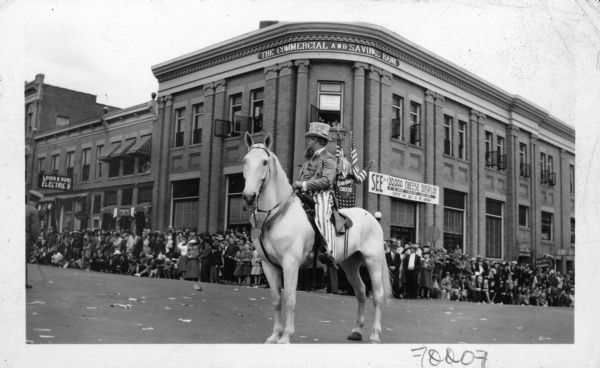 Christ M. Stauffer appearing as Uncle Sam, riding a horse, during the Cheese Day parade.