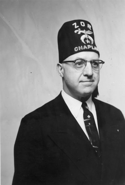 Christ M. Stauffer of Monticello, wearing his Zor Shrine chaplain hat.
