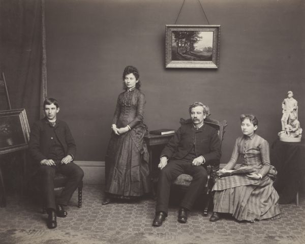 Henry Hamilton Bennett posing for a family portrait with his children Ashley, Hattie and Nellie from his first marriage to Francis (Frankie) Irene Douty.