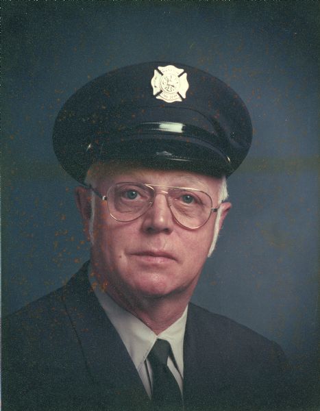 Head and shoulders portrait of George William Piernot (1922-2000). Piernot served as a member of the Madison Fire Department from about 1946 until his retirement in 1977. He primarily worked at stations 7 and 9, where he drove the ladder truck.