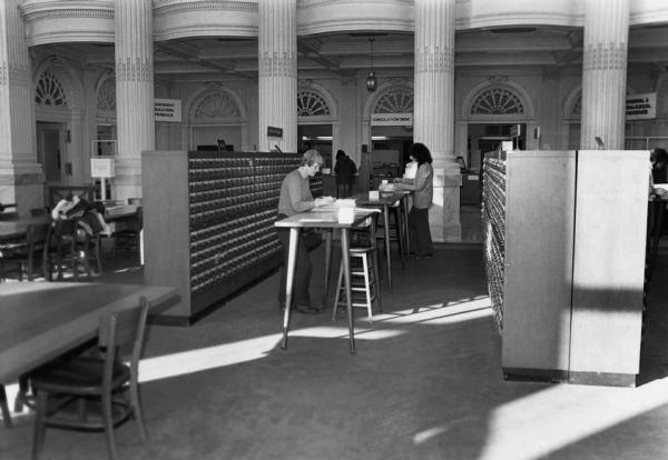 View of Wisconsin Historical Society librarians filing catalog cards.  This image is undated, but it was probably taken during the 1970s.
